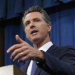 California governor: Most schools likely out until the fall
