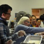 Anza enjoys a community meal