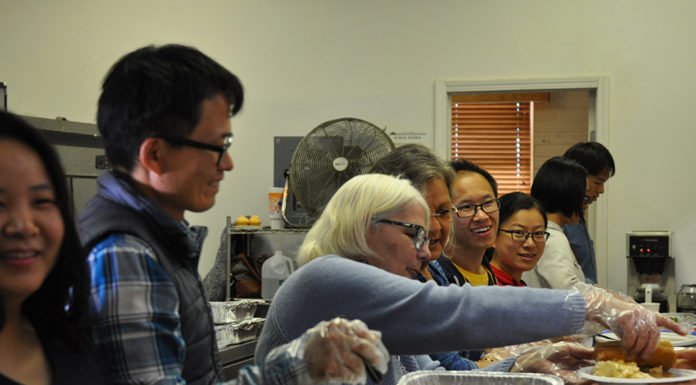 Anza enjoys a community meal