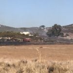 Motorcycle crash sparks brush fire in Guatay