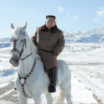 Kim rides horse on sacred peak, vows to fight US sanctions