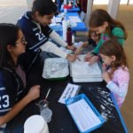 Children make their own snow at the Western Science Center’s Science Saturday