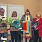 Rotarians bring a little warmth along with Christmas Day meals for seniors