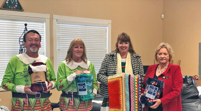 Rotarians bring a little warmth along with Christmas Day meals for seniors