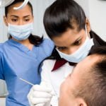 Dreading a dental visit? Five tips for getting the most out of it Dentists working on patient