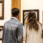 Invite someone special for an evening of art, culture and entertainment at Art Off The Walls Friday, Feb. 7 Patrons looking at art piece