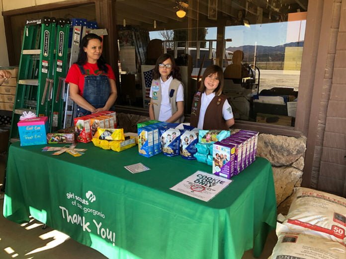 Girl scouts selling cookies