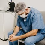 How would overwhelmed hospitals decide who to treat first?