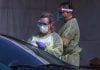 COVID-19 testing expands, as some restrictions loosen medical worker