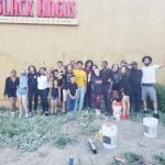 Protesters clean graffiti from vandalized Black Angus restaurant Group of members of Black Lives Matter posing in front of the wall they cleaned of graffiti