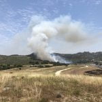 Fire in northeast portion of Camp Pendleton bordering De Luz Road halted by firefighters
