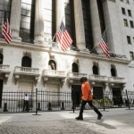 Wall Street slides, but tech strength helps avert a big loss