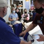 Most vaccinated California workers must keep masks on