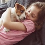 Adopters can help Animal Friends of the Valleys receive a Holiday Wishes grant Girl hugging dog