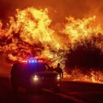 California fire that killed 3 threatens thousands of homes