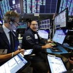 Stocks move higher on Wall Street following burst of deals