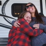 Family receives trailer for Christmas thanks to lending firm, community