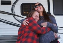 Family receives trailer for Christmas thanks to lending firm, community