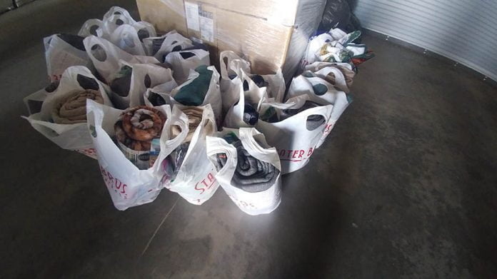 01-08-21-ANZA-AEC holds sock drive-Cphoto