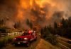 California fire prompts evacuations; Oregon blaze balloons