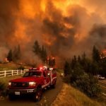 California fire prompts evacuations; Oregon blaze balloons