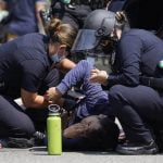 Man stabbed at LA anti-vaccination protest leaves hospital