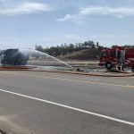 Fire consumes trash truck, causing explosion that injured firefighters