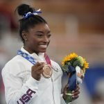 Biles returns to Olympic competition, wins bronze on beam