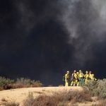 Debris fire sending thick smoke column over Nuevo quickly stopped