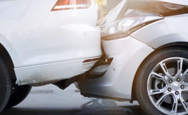 Semi and sedan crash blocks multiple lanes on I-15