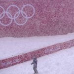 Skiers struggle as real snow falls on Winter Olympics