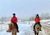 Equestrians enjoy the snow