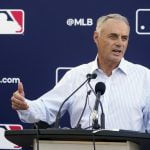 MLB players vote to end lockout, salvaging 162-game season