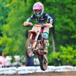 Youth motocross rider racing towards success