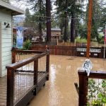 California deluge forces mass evacuations, boy swept away