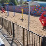 Volunteers build playground for Homeland community