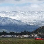 Snow, rain and rainbows sweep through the region