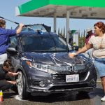 Hamilton students wash cars to raise funds for annual band trip