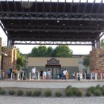 Children and adults learn the art of hula hooping at the Murrieta Town Square Amphitheater