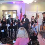 Musical performances and stories inspire an audience