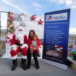 Santa Claus drops out the sky for many military service member families at Skydive Perris