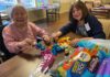 Vineyard Place residents and family members make Easter eggs for fourth graders to discover