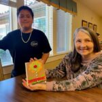 Fourth graders join older adults in Mother’s Day crafting