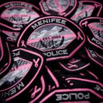 Menifee Police Department wear patches to show support for breast cancer and domestic violence awareness