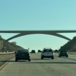 Person jumps from Lilac Bridge, disrupting traffic on I-15