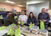 Volunteers help with rescue food packaging at Menifee’s Community Cupboard during wind crisis
