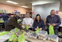 Volunteers help with rescue food packaging at Menifee’s Community Cupboard during wind crisis