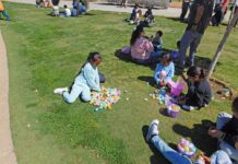 Excited youngsters run to gather thousands of prized plastic Easter eggs at Valley-Wide Community Park in Hemet