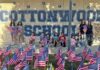 Girl Scouts honor fallen heroes with flag display at Cottonwood School