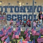 Girl Scouts honor fallen heroes with flag display at Cottonwood School